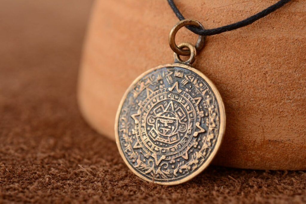 an amulet pendant for happiness and money