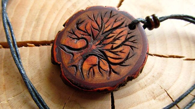 a wooden amulet for happiness