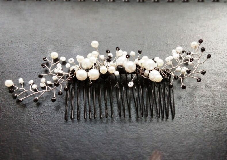 a comb with pearls like an amulet
