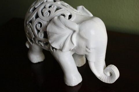 an elephant figurine as an amulet of happiness